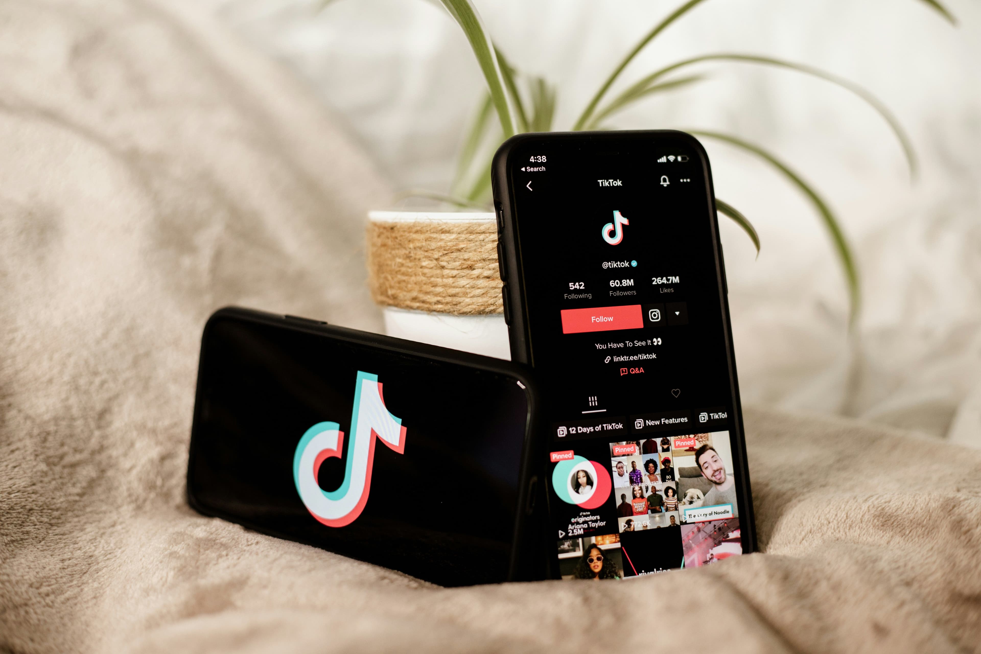 TikTok app open on two iphones
