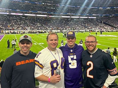 2 bears fans and 2 vikings fan at Vikings stadium