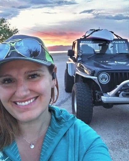 Jules Smith at Bear Lake in front of a Jeep