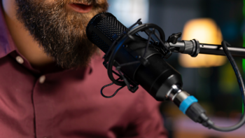 Man speaking into microphone