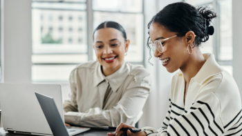 Two women looking at website audit